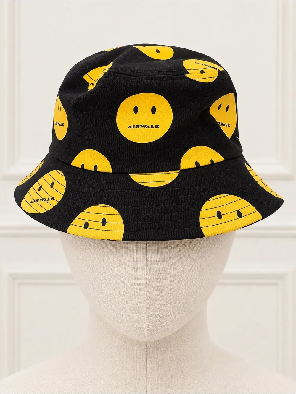 Airwalk Black Bucket Hat with Yellow Smiley Pattern